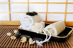 Japanese bathroom decor tray with pebbles and shoji screen